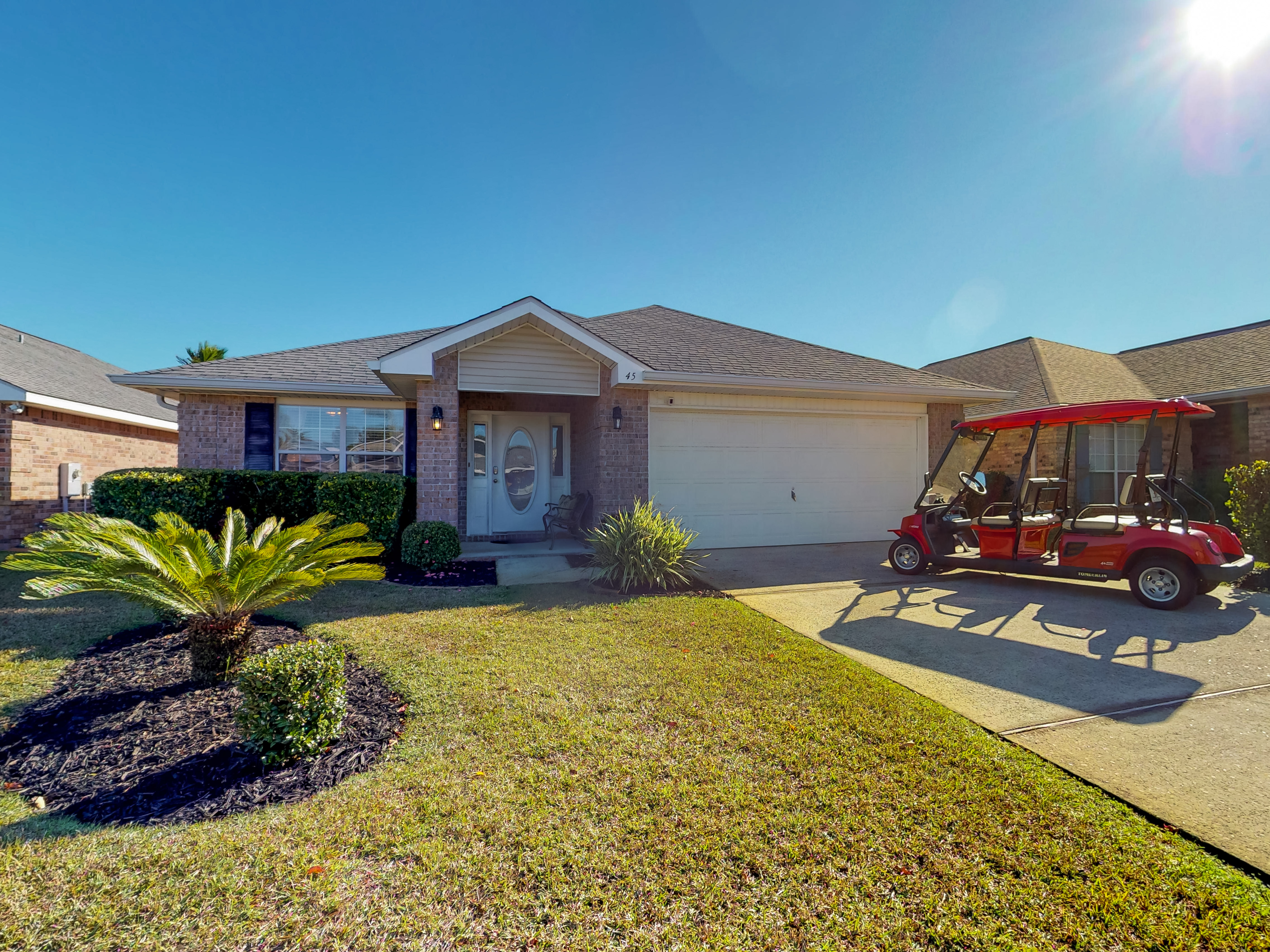 Front exterior with golf cart